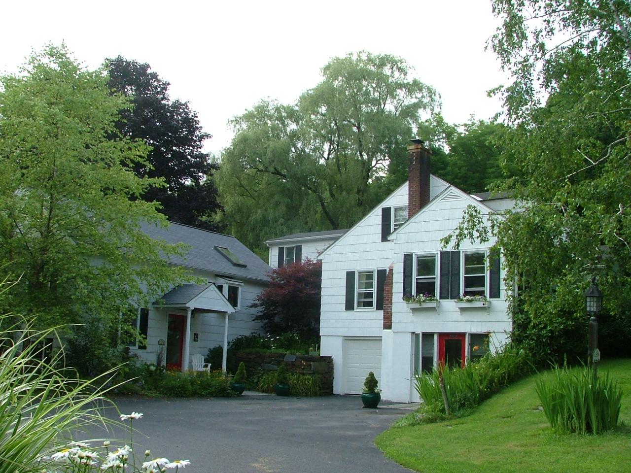 21 Interlaken Road Stockbridge, MA 01266 - Photo 1 of 16 a front view of a house with a yard
