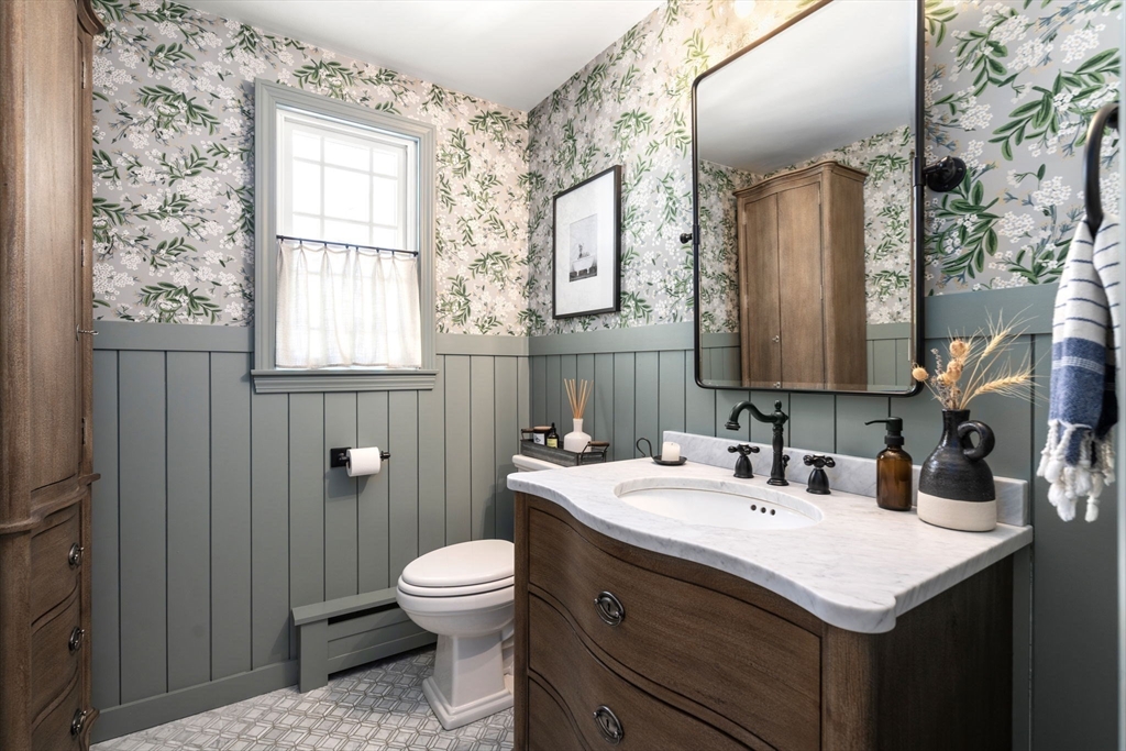 4 Stevens Road Wellesley, MA 02482 - Photo 16 of 39 a bathroom with a sink toilet and mirror