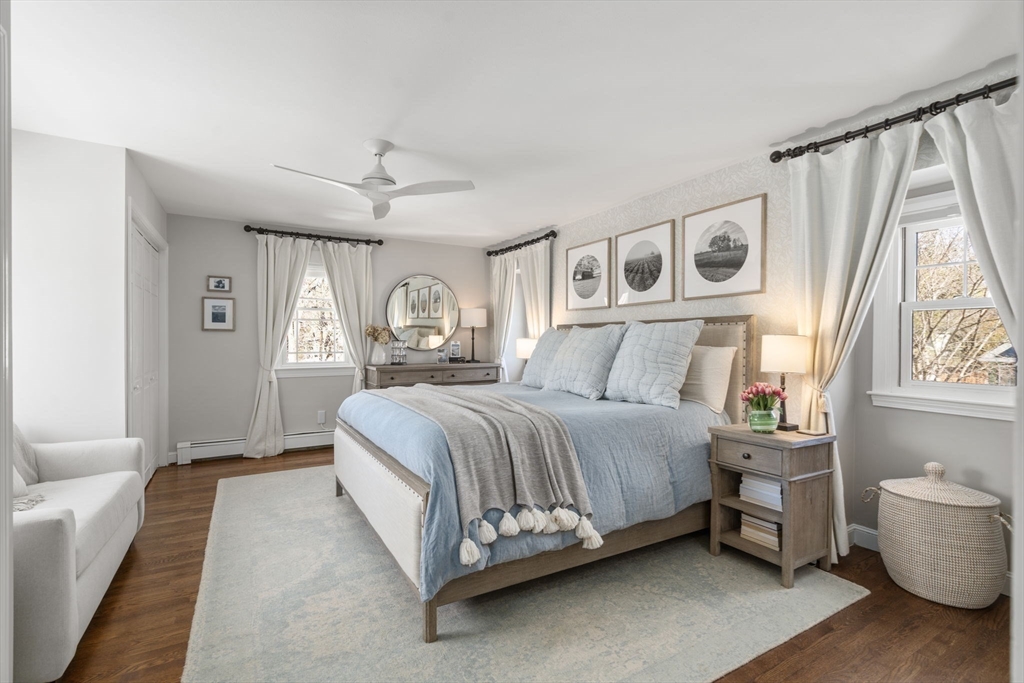 4 Stevens Road Wellesley, MA 02482 - Photo 24 of 39 a spacious bedroom with a bed couch and a window