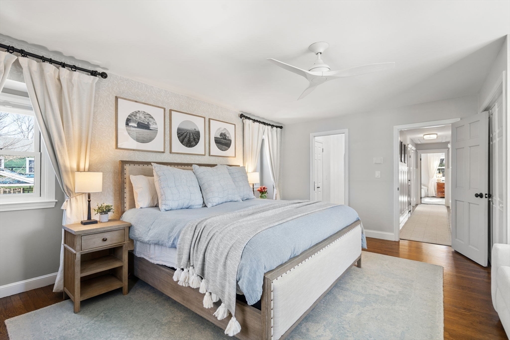 4 Stevens Road Wellesley, MA 02482 - Photo 25 of 39 a spacious bedroom with a bed and a chandelier