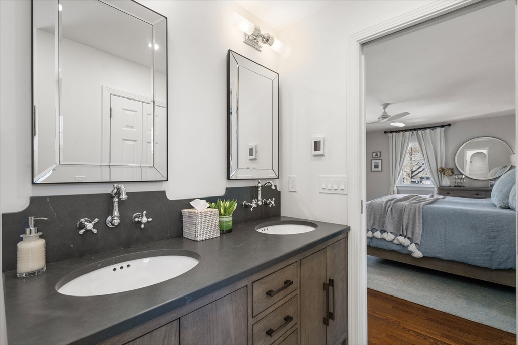 4 Stevens Road Wellesley, MA 02482 - Photo 27 of 39 a bathroom with double vanity sinks and a mirror