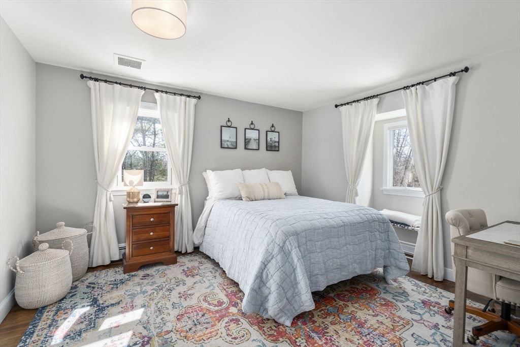 4 Stevens Road Wellesley, MA 02482 - Photo 32 of 39 a bedroom with a bed and wooden floor