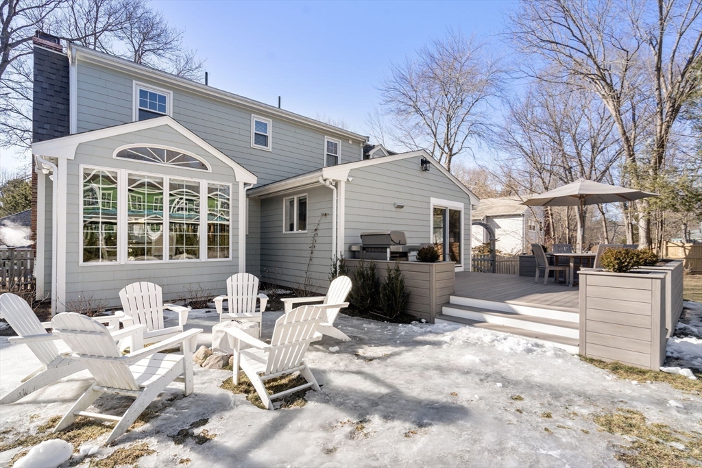 4 Stevens Road Wellesley, MA 02482 - Photo 36 of 39 a view of a patio with couches table and chairs and wooden fence