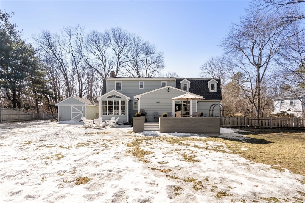 4 Stevens Road Wellesley, MA 02482 - Photo 37 of 39 a front view of a house with a yard covered in snow