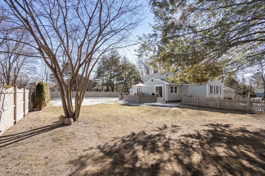 4 Stevens Road Wellesley, MA 02482 - Photo 38 of 39 a front view of a house with a yard covered in snow