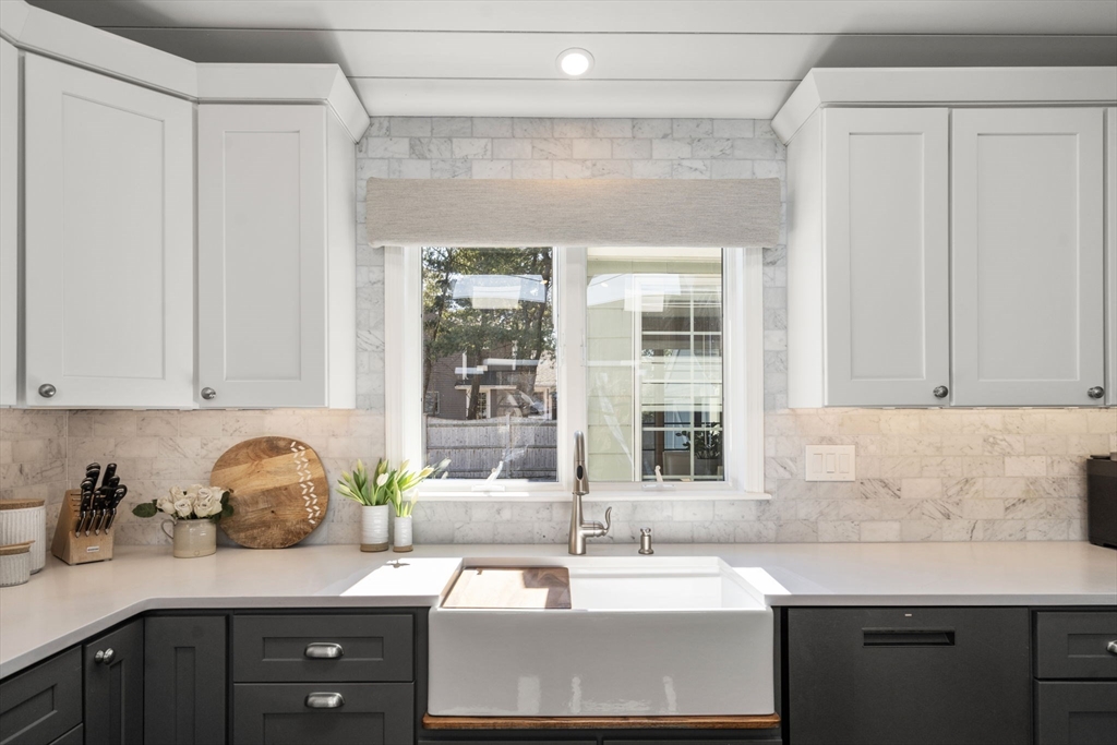4 Stevens Road Wellesley, MA 02482 - Photo 7 of 39 a kitchen with granite countertop a sink and cabinets