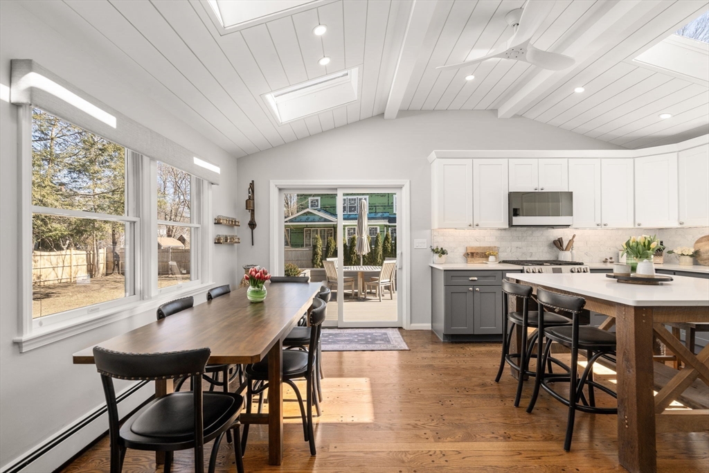 4 Stevens Road Wellesley, MA 02482 - Photo 9 of 39 a kitchen with a dining table chairs and refrigerator
