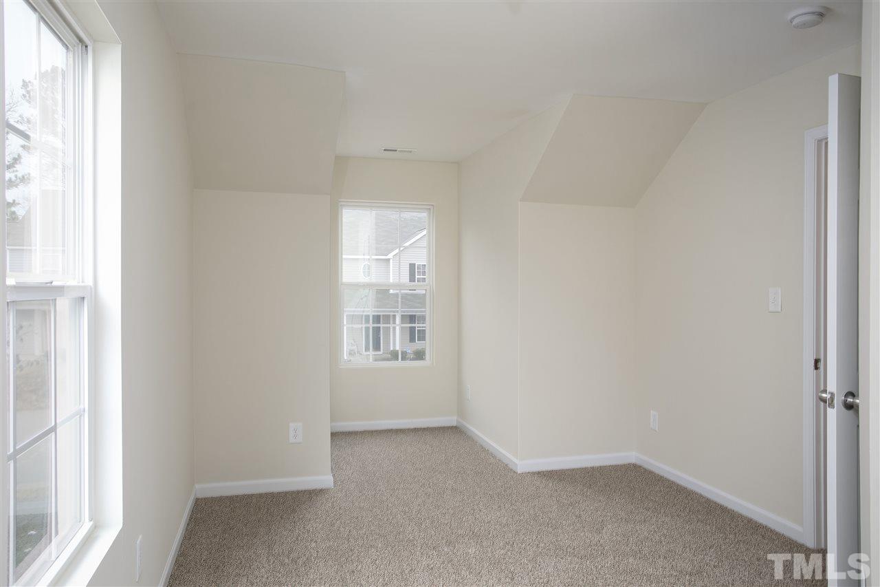 1112 Lombar Street Raleigh, NC 27610 - Photo 15 of 19 an empty room with windows