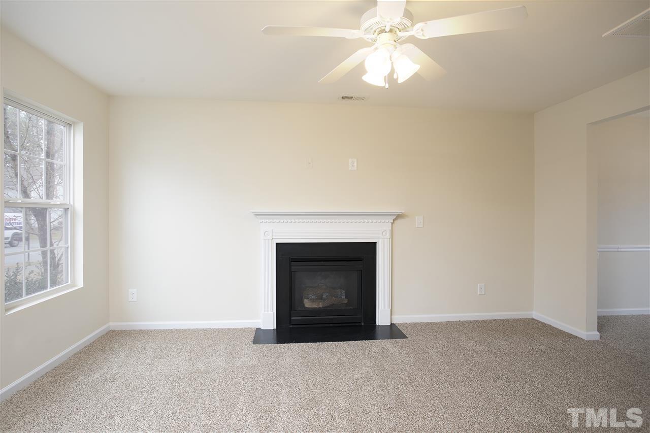 1112 Lombar Street Raleigh, NC 27610 - Photo 3 of 19 a view of empty room with fireplace