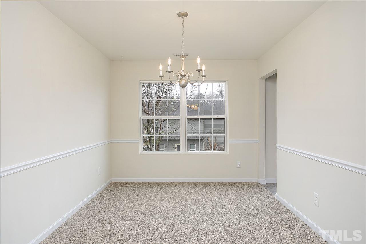 1112 Lombar Street Raleigh, NC 27610 - Photo 5 of 19 a view of an empty room with a window