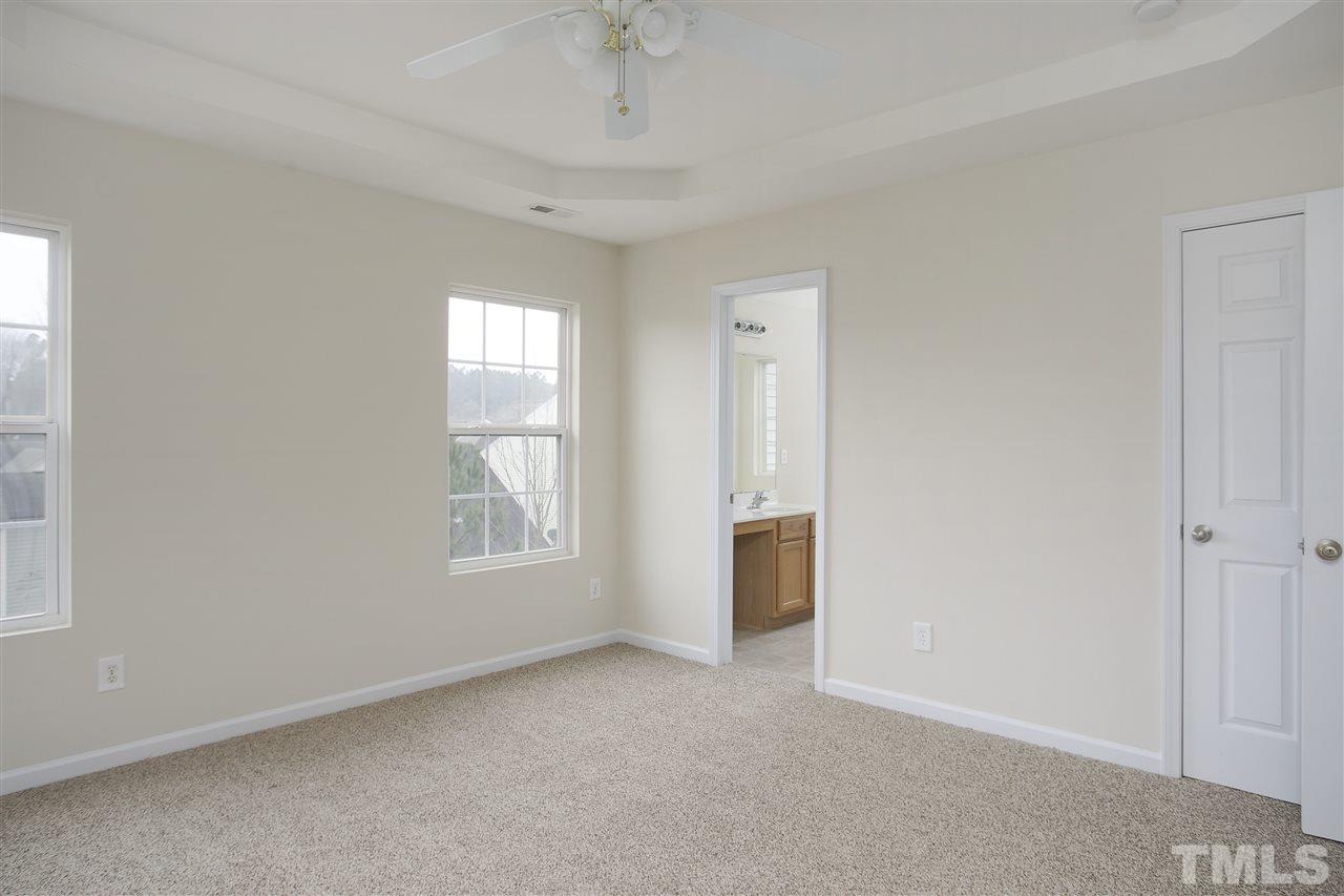 1112 Lombar Street Raleigh, NC 27610 - Photo 9 of 19 an empty room with windows and closet