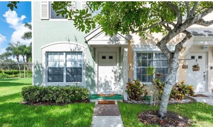 19 Whitehead Circle Weston, FL 33326 - Photo 6 of 6 a front view of a house with garden