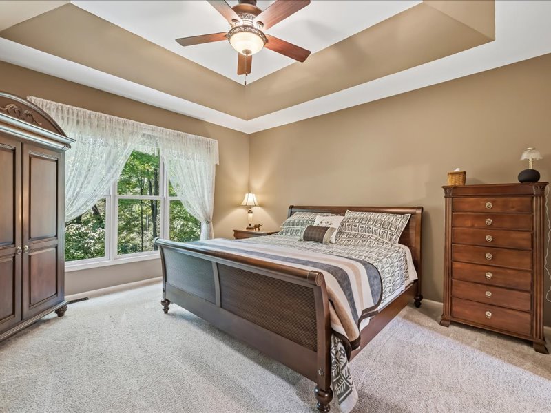 1168 Mt Pleasant Road Bangor, PA 18013 - Photo 48 of 100 An elegant tray ceiling and wooded views define this comfortable bedroom retreat.