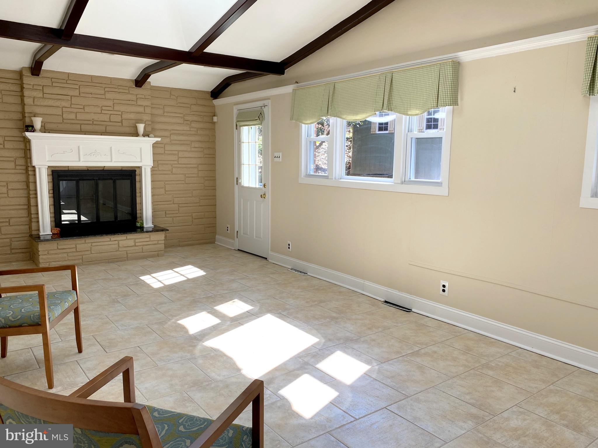 630 Lafayette Road Merion Station, PA 19066 - Photo 14 of 27 Family Room with Fireplace & door to rear Terrace