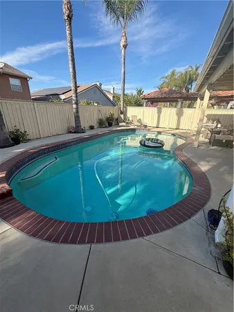 a view of a swimming pool with a chairs