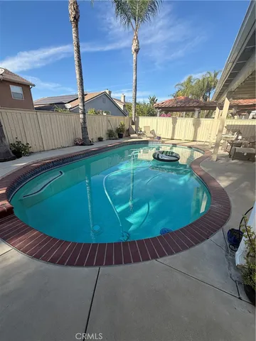 a view of a swimming pool with a chairs