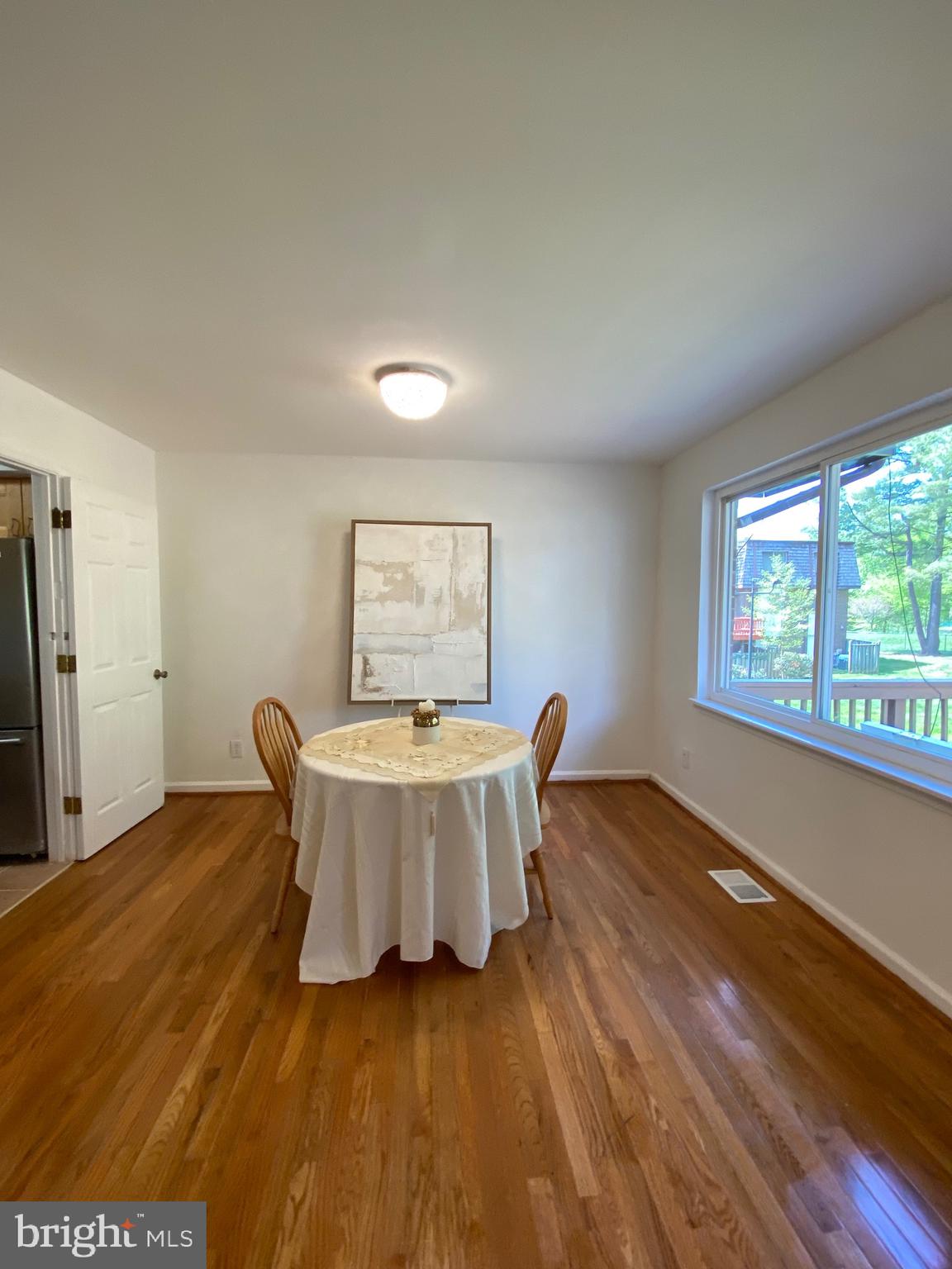 322 West Deer Park Road, Unit 2C Gaithersburg, MD 20877 - Photo 12 of 32 a living room with a couch and a table