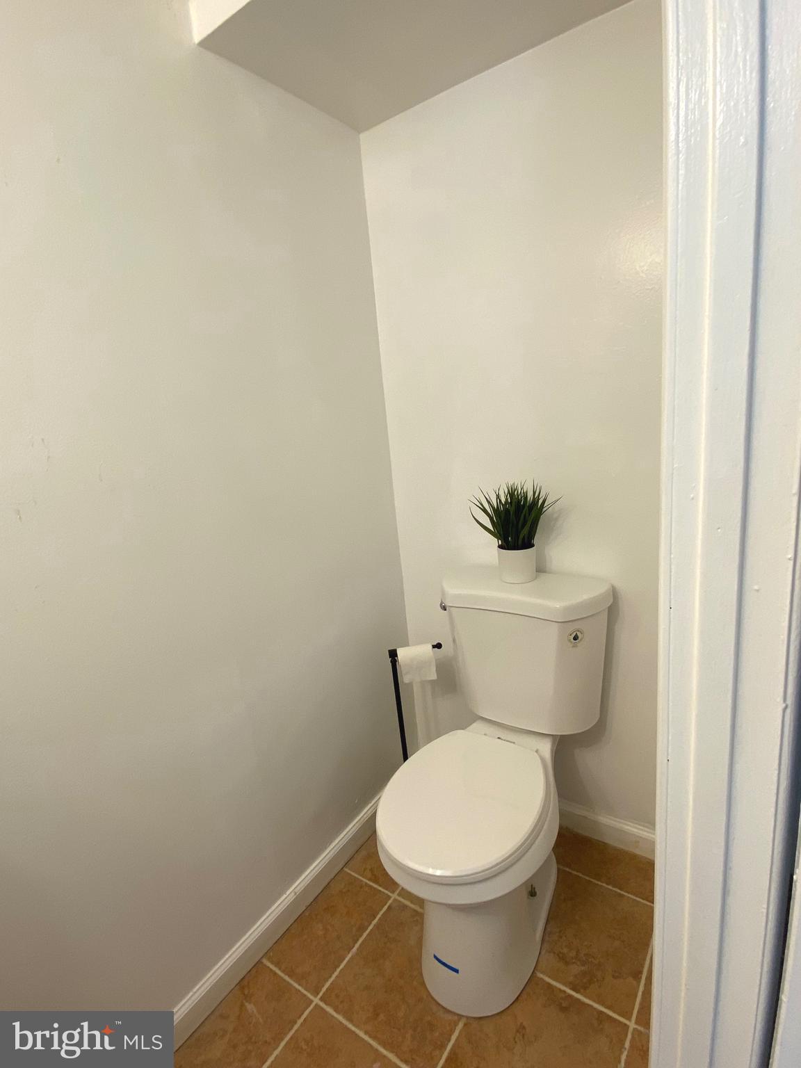 322 West Deer Park Road, Unit 2C Gaithersburg, MD 20877 - Photo 14 of 32 a white toilet sitting next to a white sink