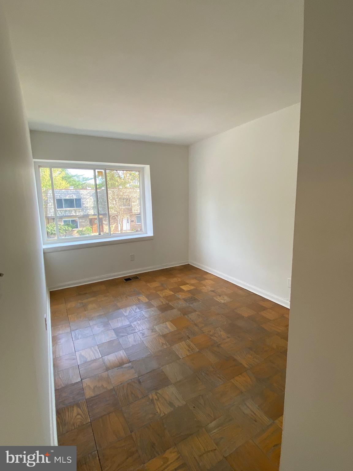 322 West Deer Park Road, Unit 2C Gaithersburg, MD 20877 - Photo 20 of 32 an empty room with a empty space and windows