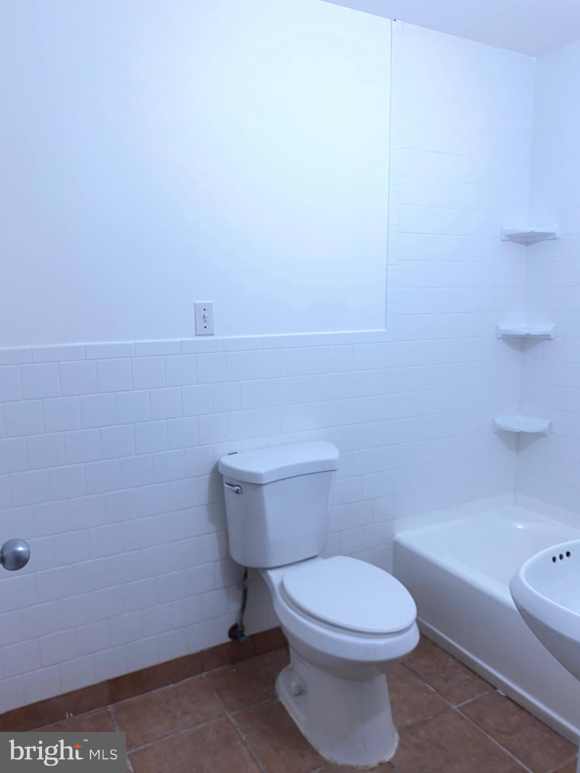 322 West Deer Park Road, Unit 2C Gaithersburg, MD 20877 - Photo 28 of 32 a white toilet sitting next to a bath tub