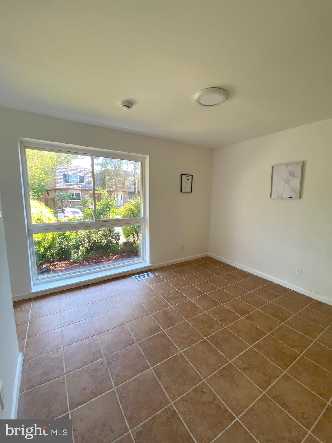322 West Deer Park Road, Unit 2C Gaithersburg, MD 20877 - Photo 30 of 32 a view of an empty room with a window