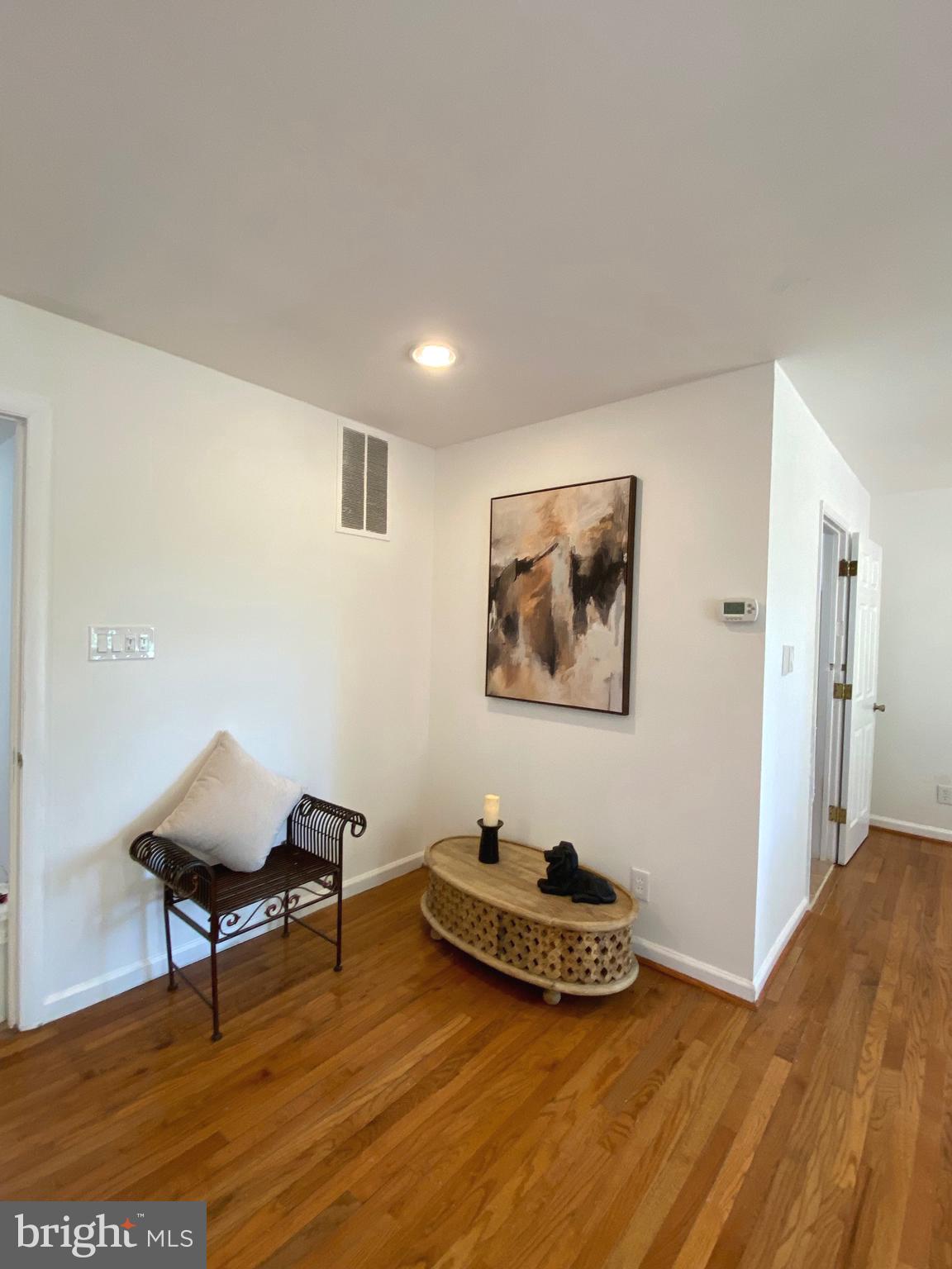 322 West Deer Park Road, Unit 2C Gaithersburg, MD 20877 - Photo 5 of 32 a room with a table and couch
