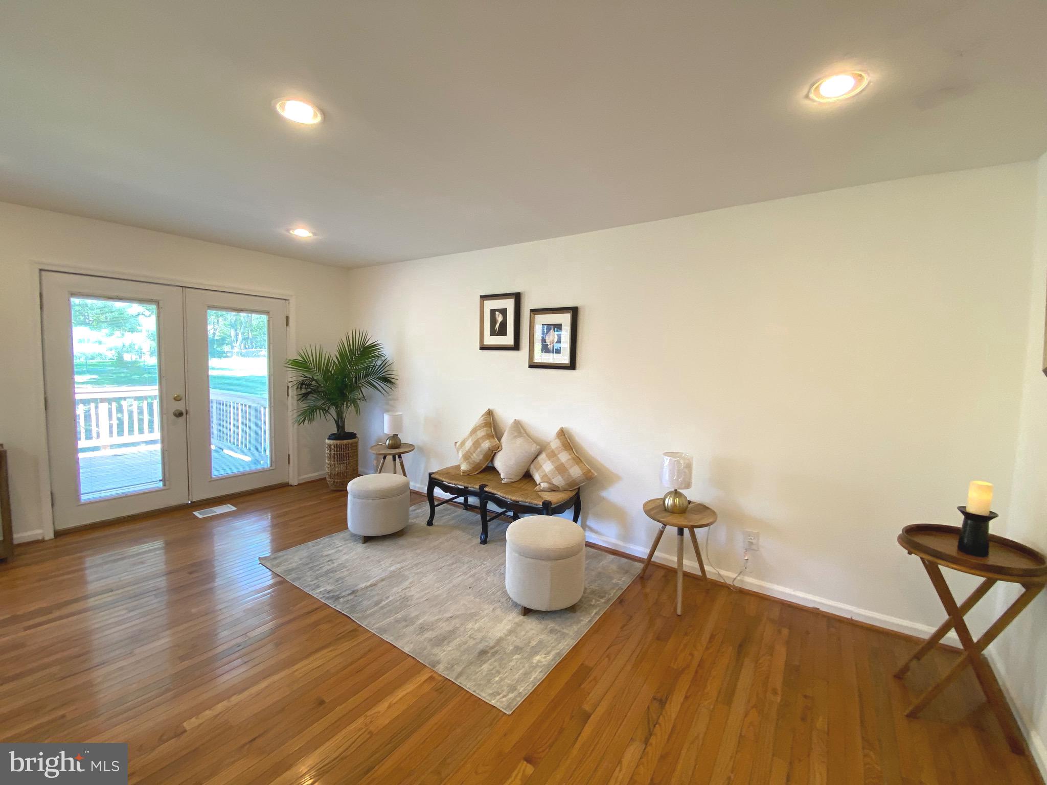 322 West Deer Park Road, Unit 2C Gaithersburg, MD 20877 - Photo 6 of 32 a living room with furniture and wooden floor