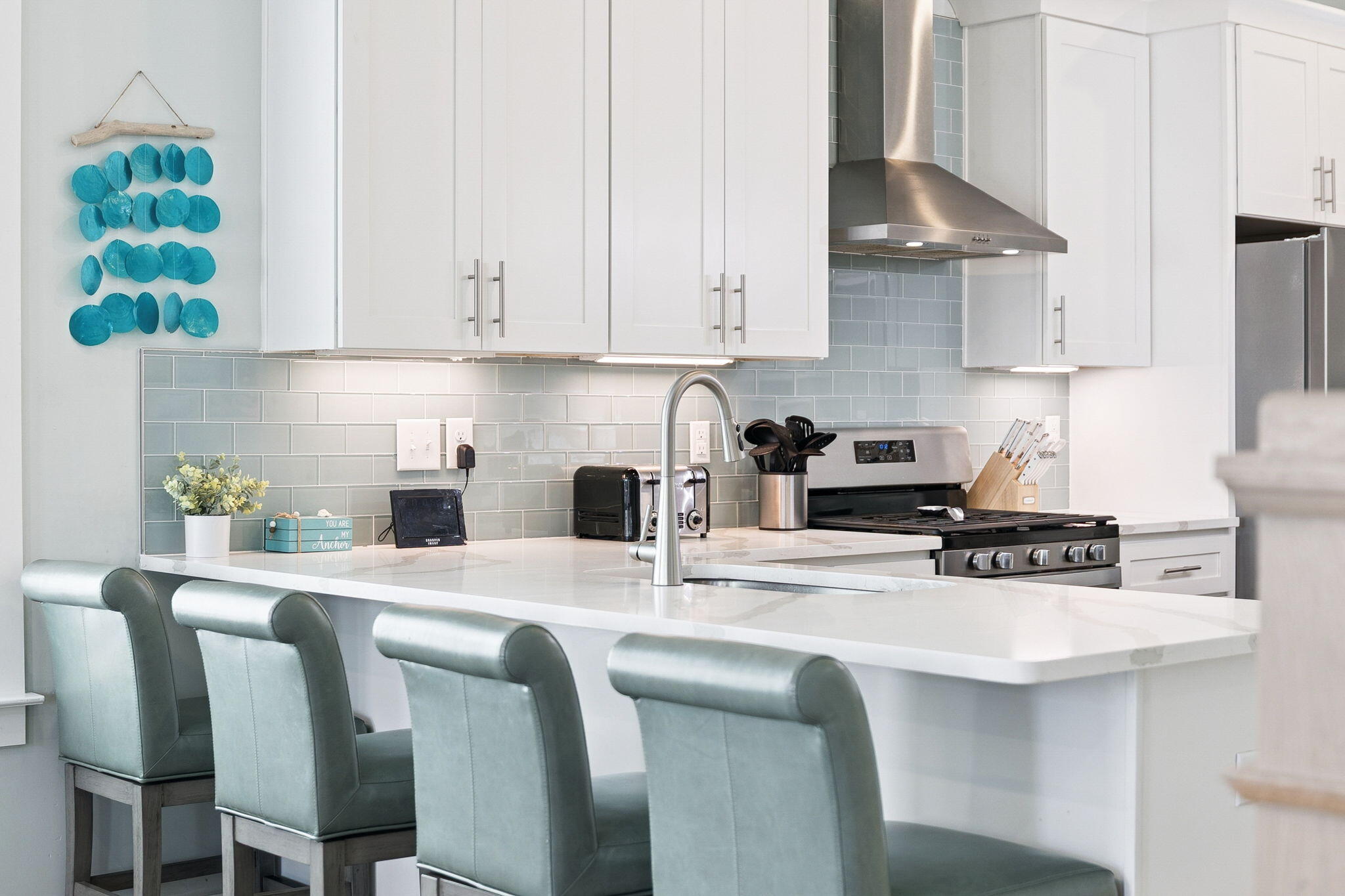 345 Dolphin Drive Santa Rosa Beach, FL 32459 - Photo 15 of 73 a kitchen with stainless steel appliances granite countertop a sink a stove and white cabinets