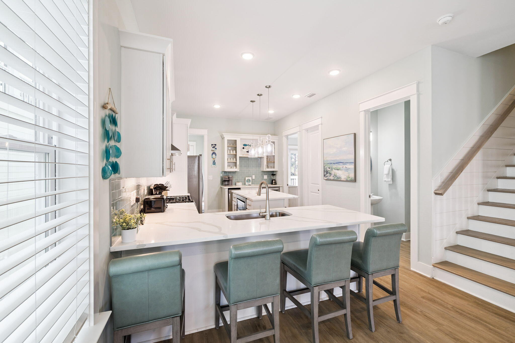 345 Dolphin Drive Santa Rosa Beach, FL 32459 - Photo 17 of 73 a kitchen with a dining table chairs and cabinets