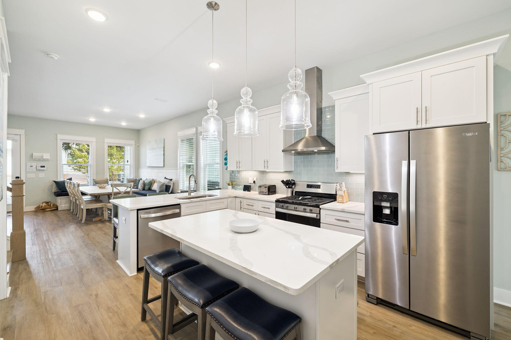 345 Dolphin Drive Santa Rosa Beach, FL 32459 - Photo 20 of 73 a kitchen with stainless steel appliances a refrigerator a stove a sink a dining table and chairs