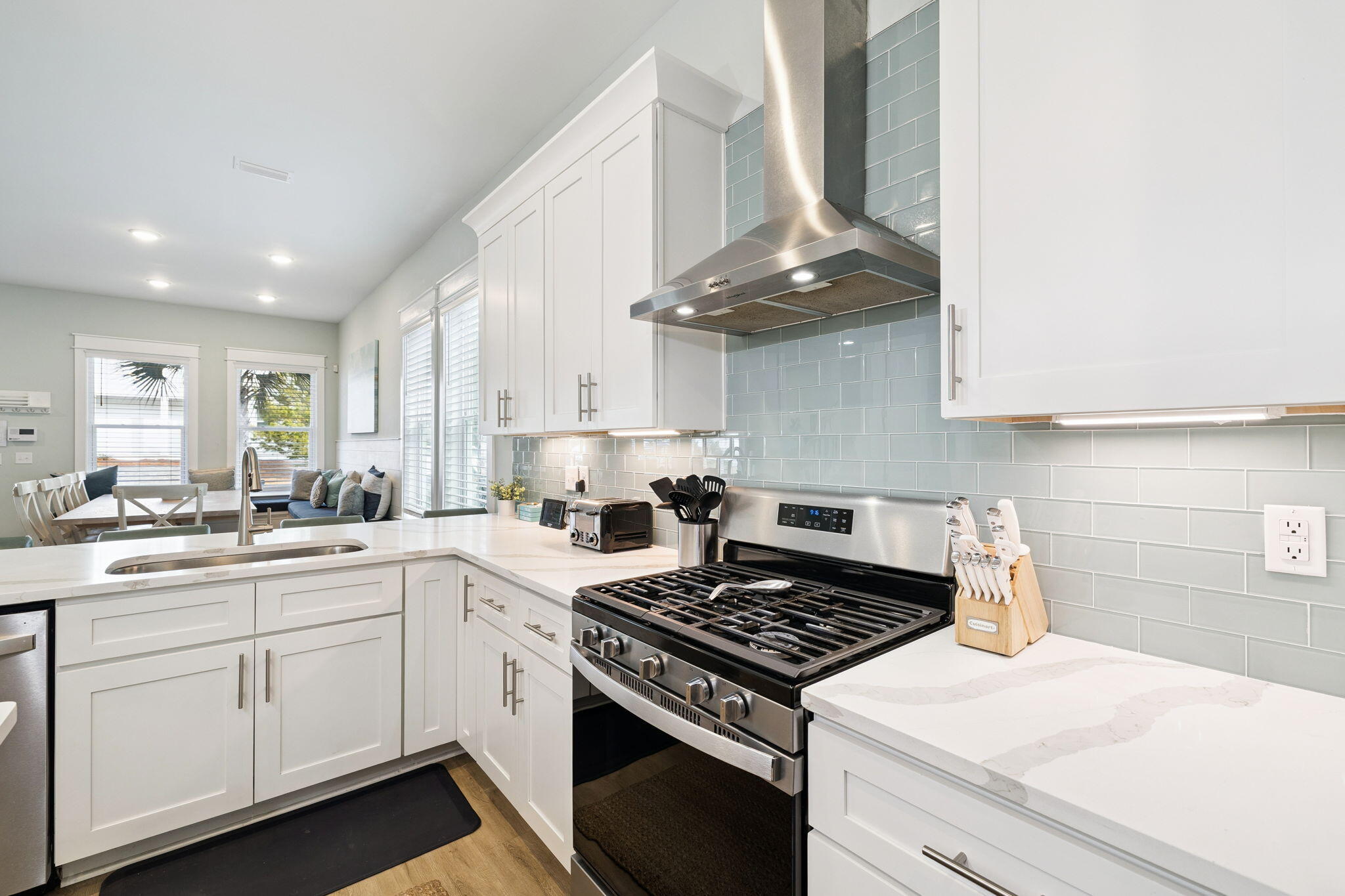 345 Dolphin Drive Santa Rosa Beach, FL 32459 - Photo 21 of 73 a kitchen with a stove a sink and cabinets