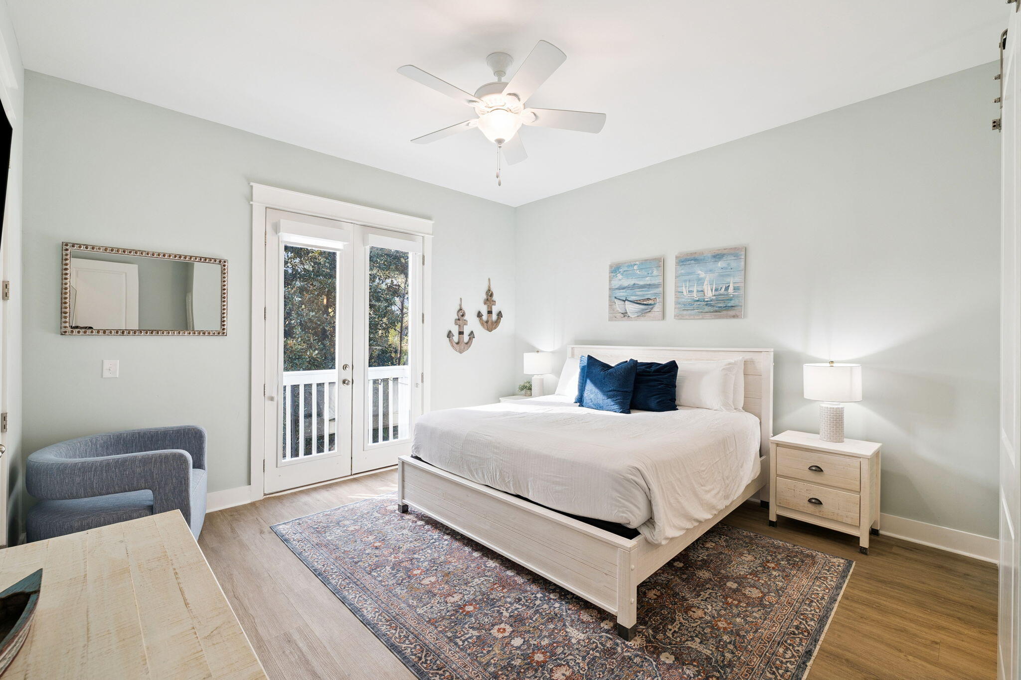 345 Dolphin Drive Santa Rosa Beach, FL 32459 - Photo 26 of 73 a bedroom with a large bed and a chandelier