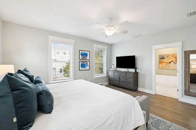 a bedroom with a bed and a mirror