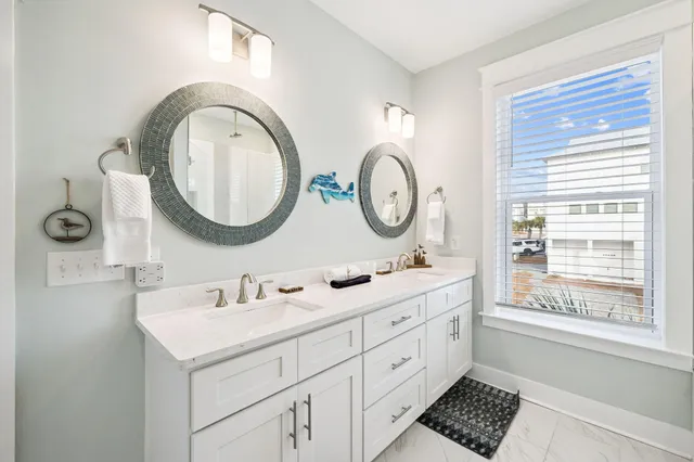 a living room with furniture a flat screen tv and a table