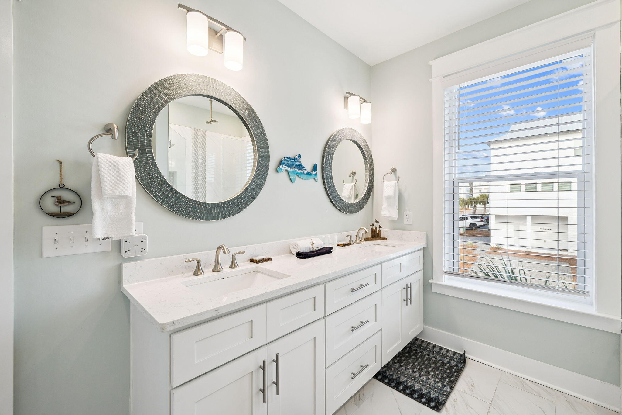 345 Dolphin Drive Santa Rosa Beach, FL 32459 - Photo 34 of 73 a bathroom with a double vanity sink and a window