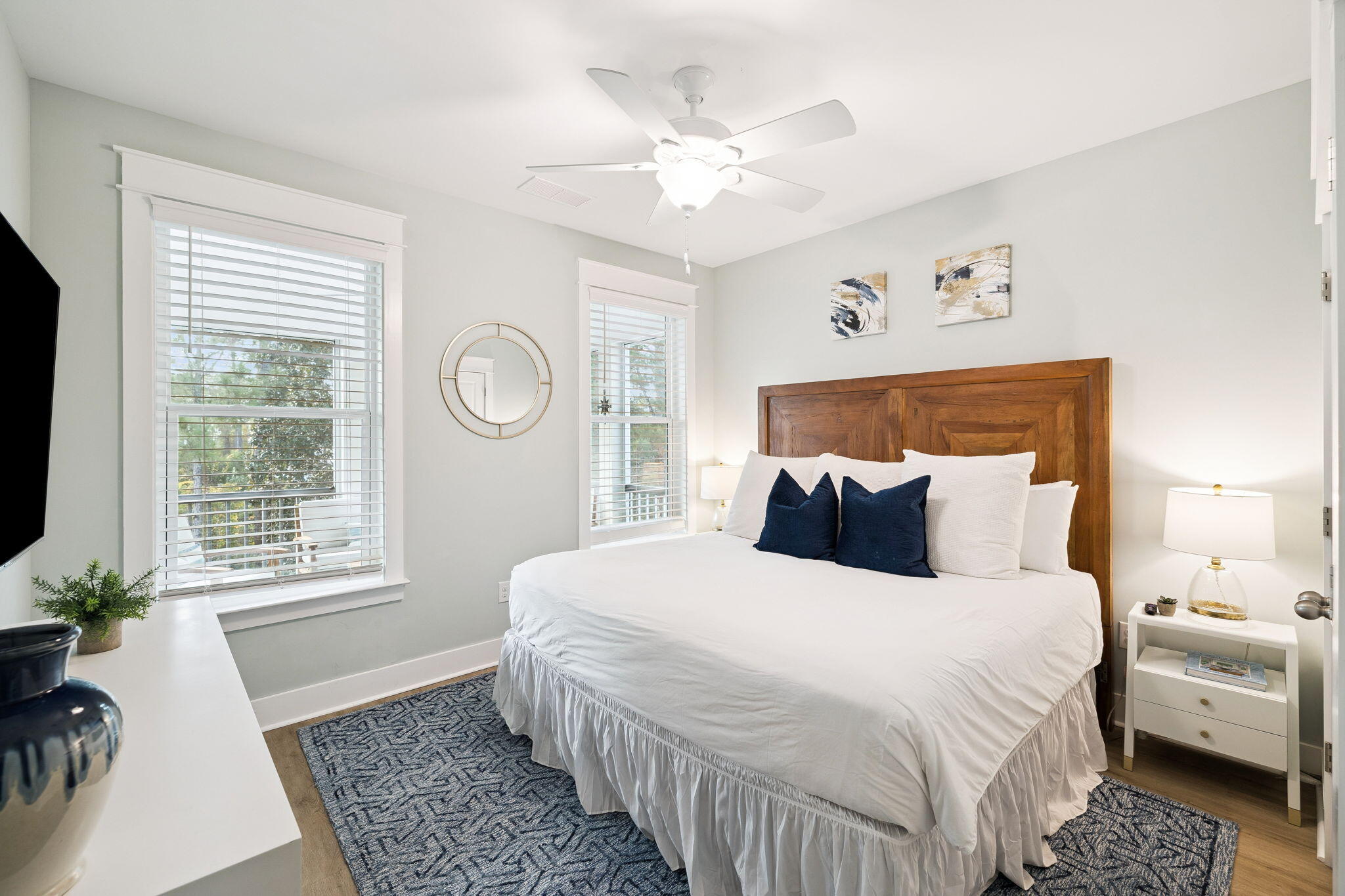 345 Dolphin Drive Santa Rosa Beach, FL 32459 - Photo 38 of 73 a bedroom with a large bed and a chandelier