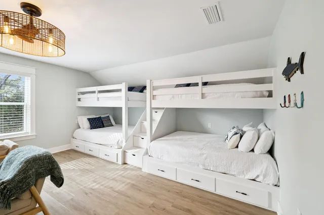a view of a patio with couches table and chairs and potted plants