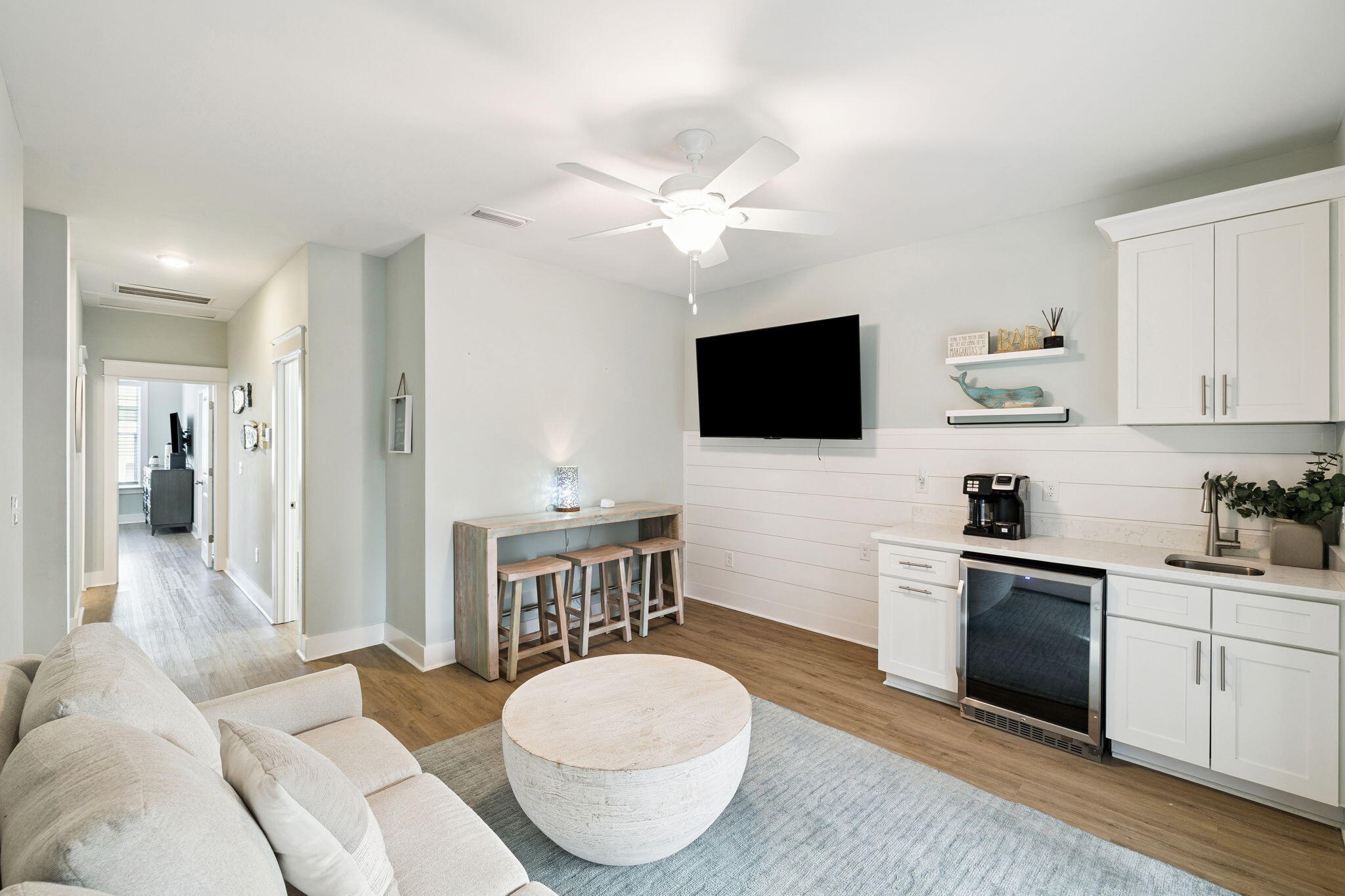 345 Dolphin Drive Santa Rosa Beach, FL 32459 - Photo 51 of 73 a living room with furniture a flat screen tv and kitchen view