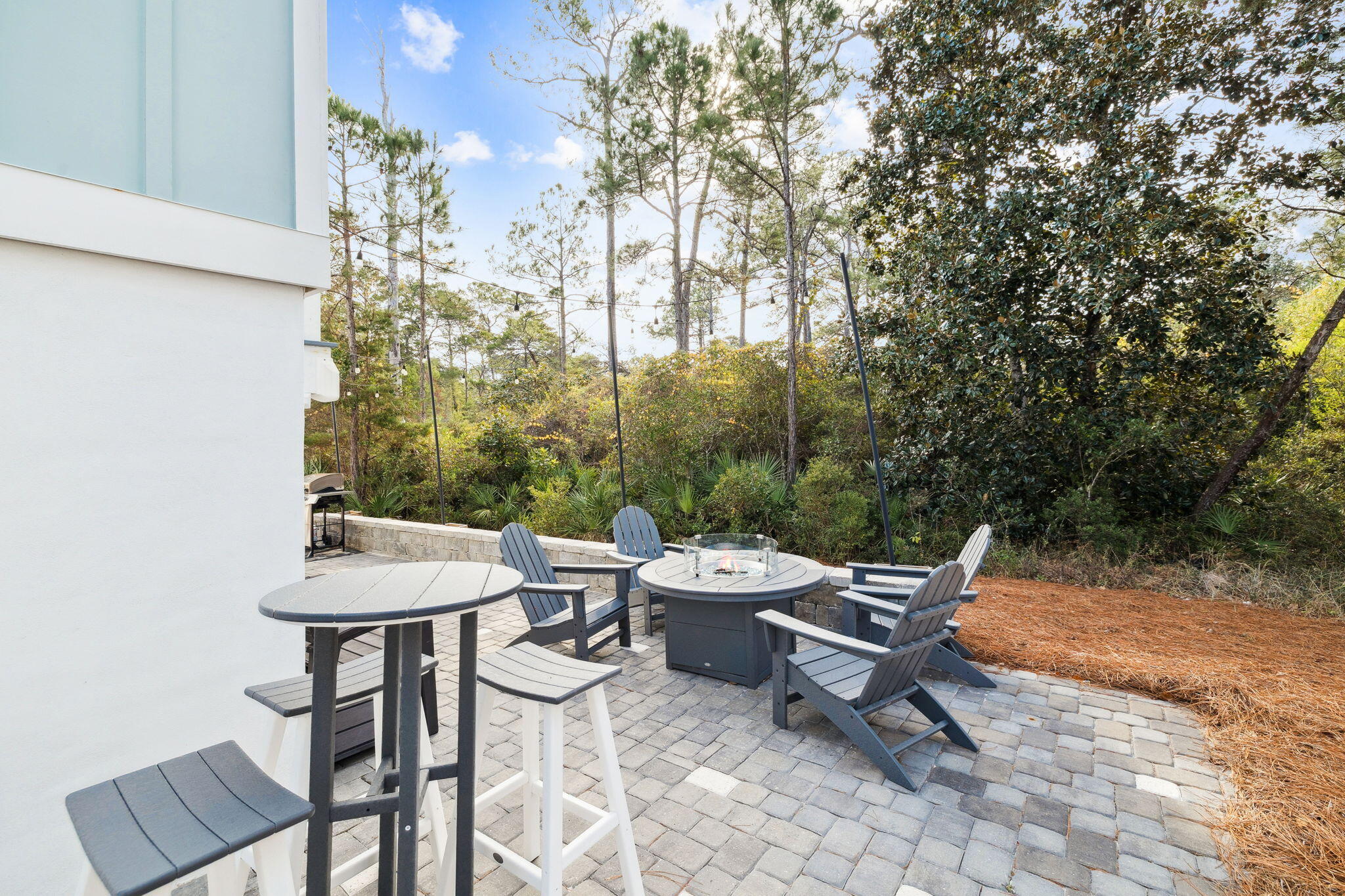 345 Dolphin Drive Santa Rosa Beach, FL 32459 - Photo 62 of 73 a backyard of a house with table and chairs