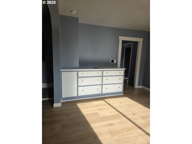 a view of cabinet and mirror