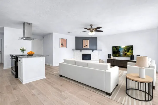 a living room with furniture and a flat screen tv