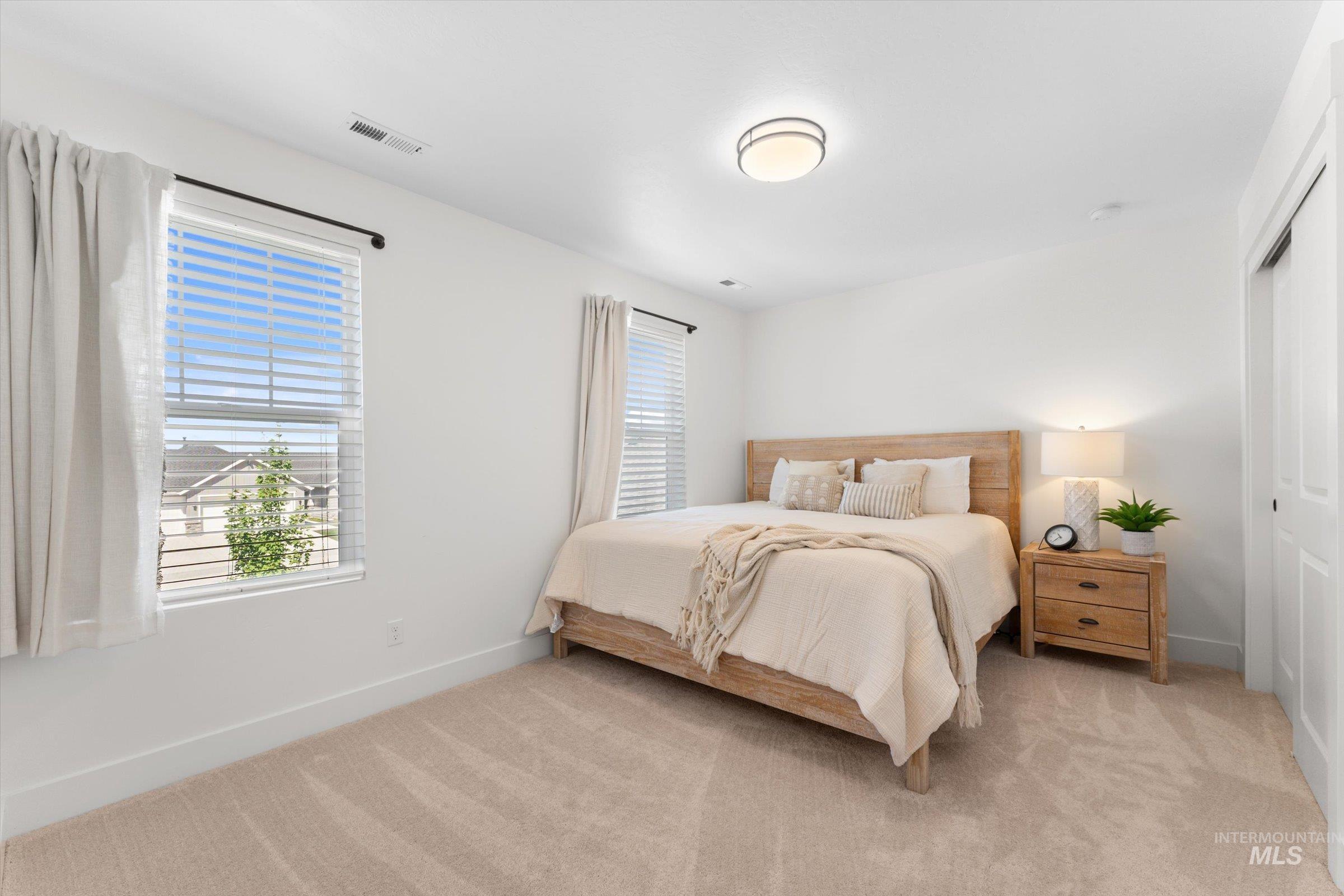 2172 Savoy Court Middleton, ID 83644 - Photo 22 of 46 Neutral toned carpeting complements bright white walls