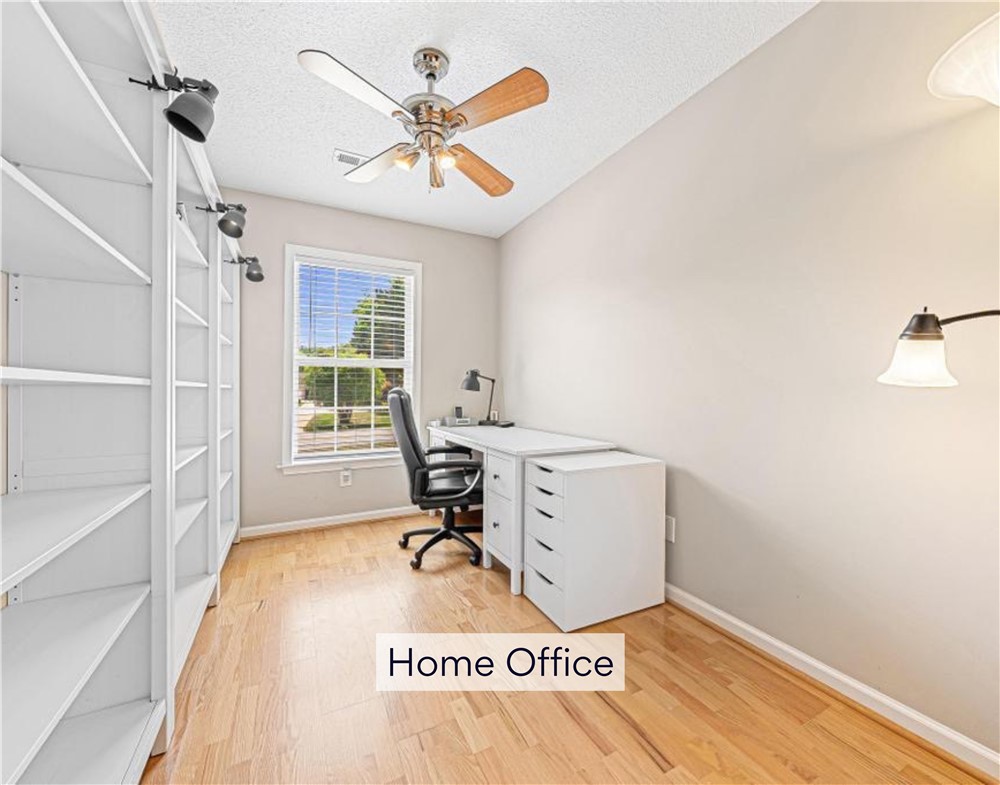 848 Perkins Creek Road Seneca, SC 29678 - Photo 17 of 26 Sun-drenched home office with ample built-in shelving, perfect for productivity and organization.