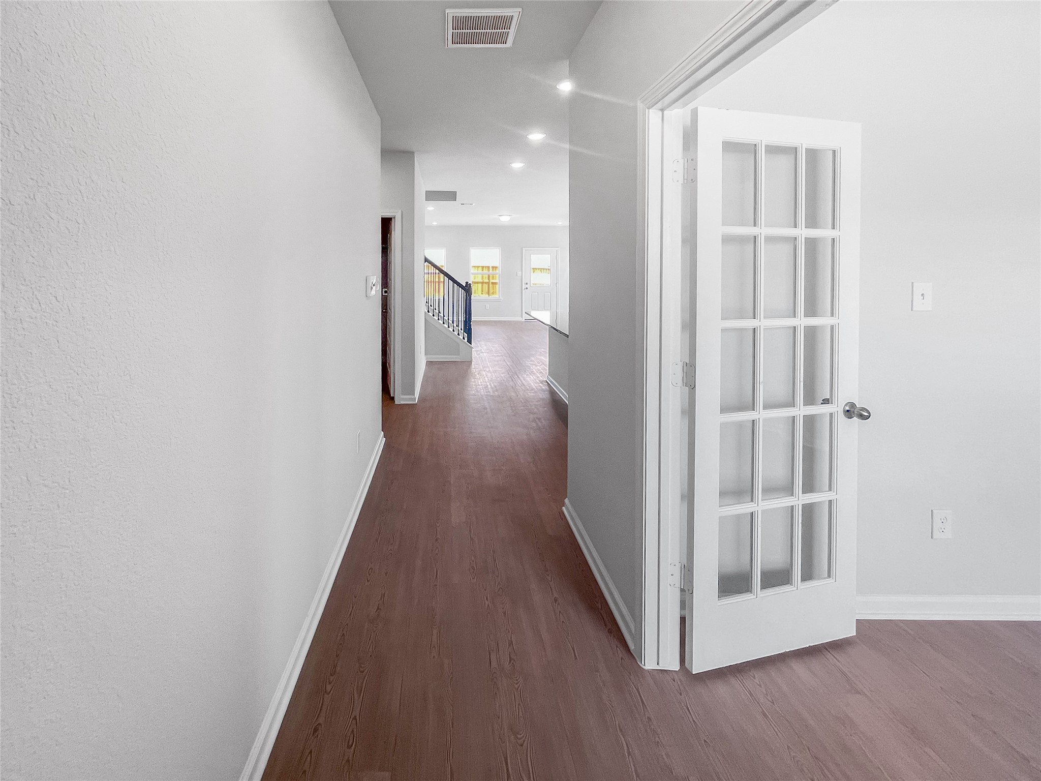 The Waring III- Foyer into Study with French doors. Sample image for illustration; upgrades, options, and colors may vary.
