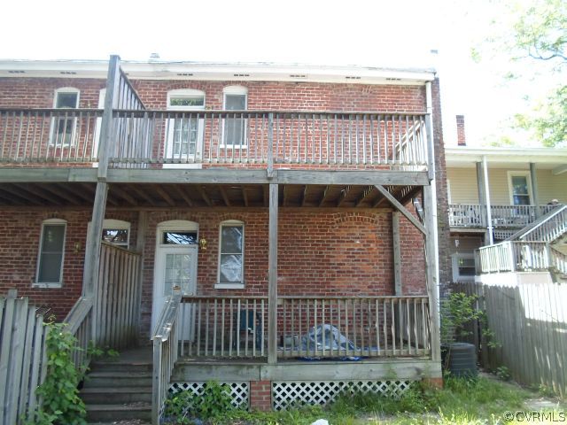 1312 Decatur Street Richmond, VA 23224 - Photo 7 of 7 a view of a house with wooden deck