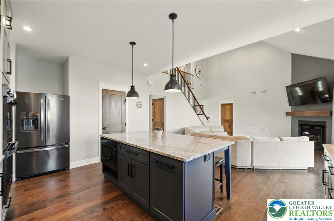 4733 Egypt Road Coplay, PA 18037 - Photo 13 of 40 a kitchen with a refrigerator a sink and wooden floor