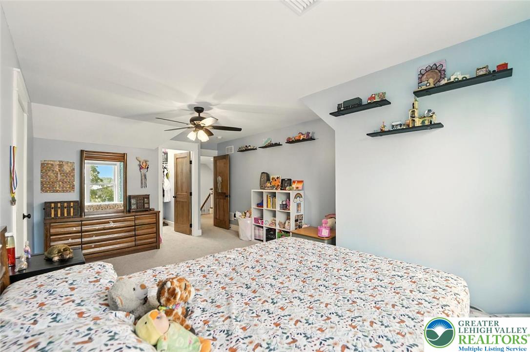 4733 Egypt Road Coplay, PA 18037 - Photo 19 of 40 a bedroom with a bed and wooden floor