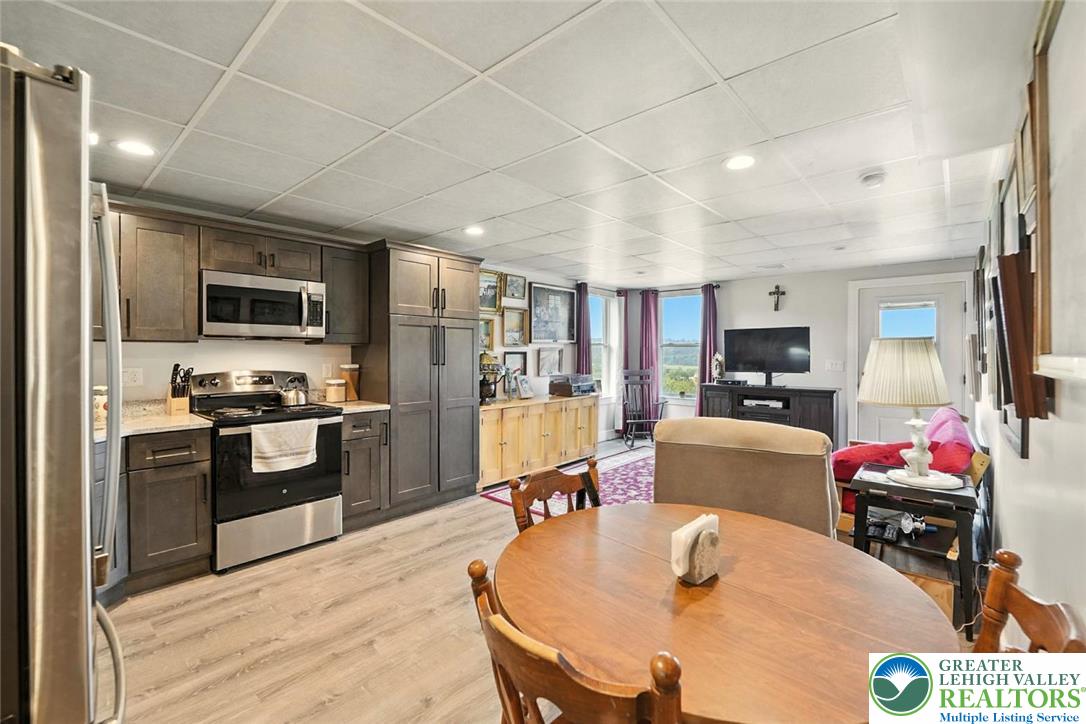 4733 Egypt Road Coplay, PA 18037 - Photo 26 of 40 a kitchen with granite countertop a stove and refrigerator