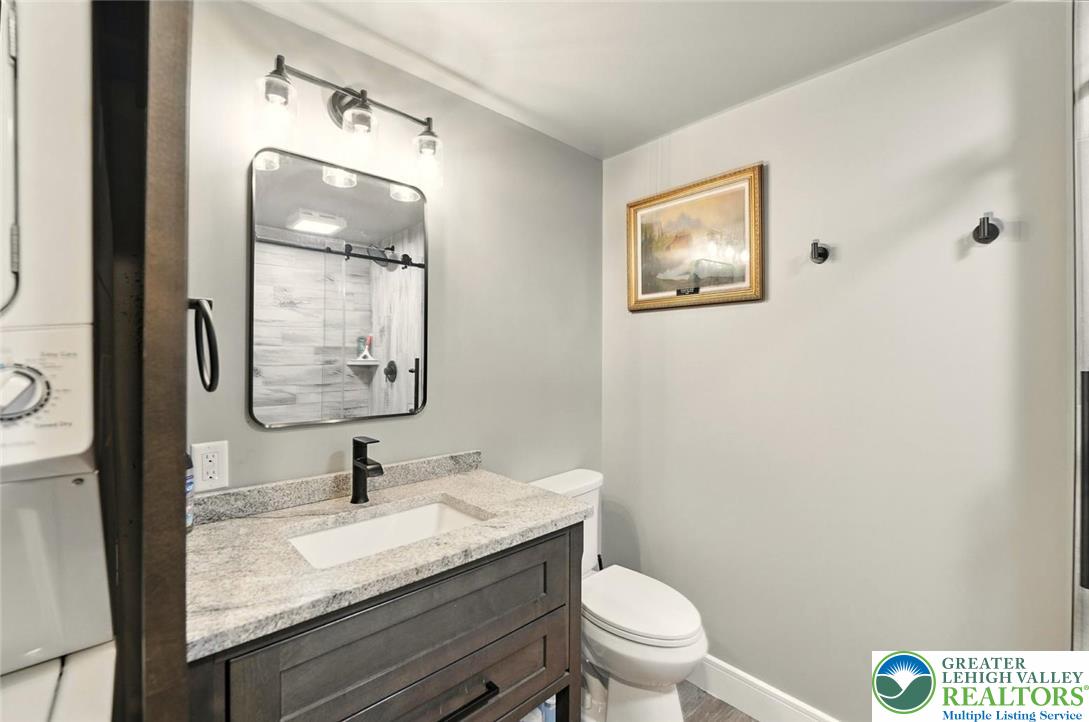 4733 Egypt Road Coplay, PA 18037 - Photo 30 of 40 a bathroom with a granite countertop sink mirror vanity and toilet