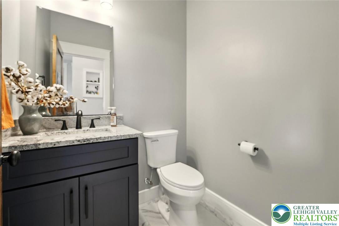 4733 Egypt Road Coplay, PA 18037 - Photo 33 of 40 a bathroom with a granite countertop sink mirror and toilet